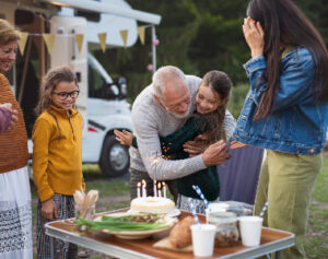 httpselements.envato.comsmall-girl-celebrating-birthday-outdoors-at-campsi-SZSNM93.jpg